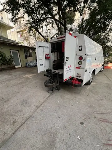 Magnet Plumbing service vehicle on-site for Grease Trap Cleaning in Wilna